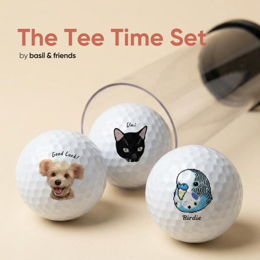 The Tee Time Set of 3 custom pet golf balls in packaging, featuring a dog, a black cat, and a parrot, showing you can print different pets on each ball.