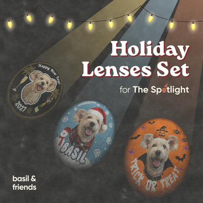 Three custom holiday lenses projecting festive dog portraits for The Spotlight pet collar projector, including New Year, Christmas, and Halloween themes.