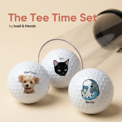 The Tee Time Set of 3 custom pet golf balls in packaging, featuring a dog, a black cat, and a parrot, showing you can print different pets on each ball.